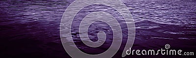 Black purple violet water surface. Night. Gradient. Reflection. Small waves. Night. Ripples. Calm. Beautiful background with space Stock Photo