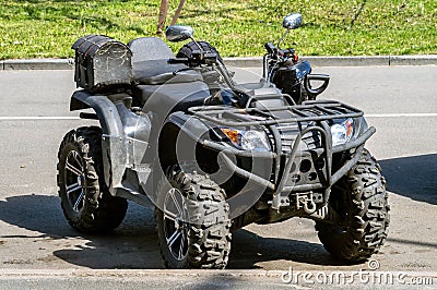 black quad bike on the street Stock Photo