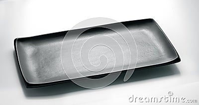 Black rectangular plate for sushi and asian cuisine top view on a white background Stock Photo