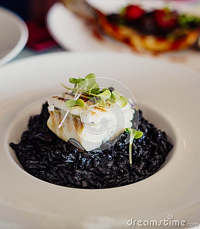 Black rice with cuttlefish and squid ink Stock Photo