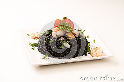 Black rice with cuttlefish on white Stock Photo