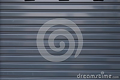 Black roller shutter door closed security background Stock Photo