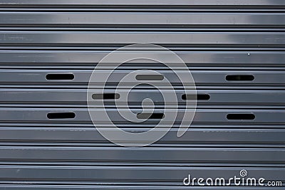 Black roller shutter door closed security background Stock Photo