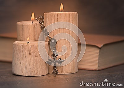 Black rosary candles and crucifix Stock Photo