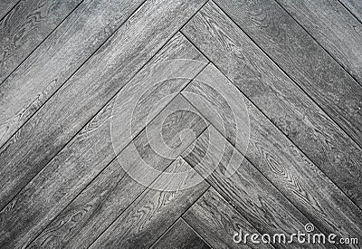 Black rough wooden background, parquet floor herringbone pattern Stock Photo