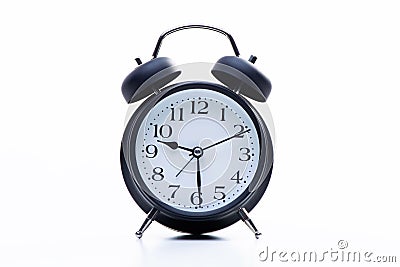 Black round metallic retro alarm clock isolated on white background. The clock shows daytime working hours Stock Photo