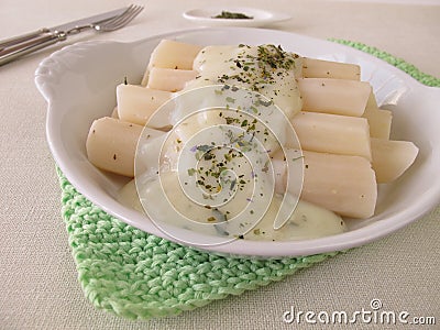 Black salsify roots with bechamel sauce Stock Photo