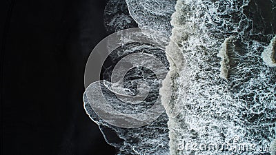 The black sand beach in Iceland. Sea aerial view and top view. A Stock Photo