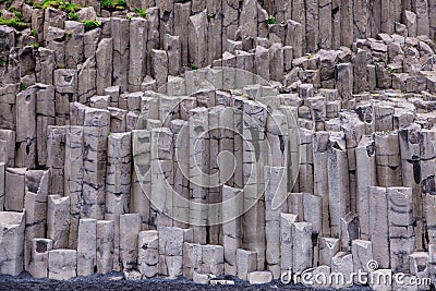 The black sand beach with unusual rock formation Stock Photo