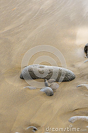 Black sand beach, volcanic stones Stock Photo