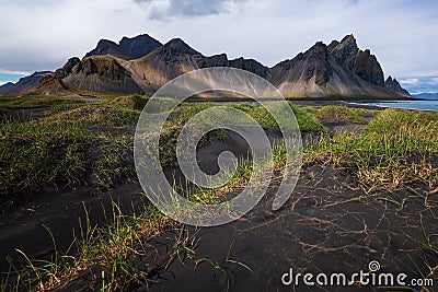 Black sand dunes with the Vestrahorn Batman Mountain in summer ,Iceland. Stock Photo