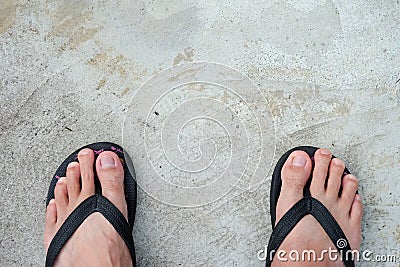 black sandals on the cement floor Stock Photo