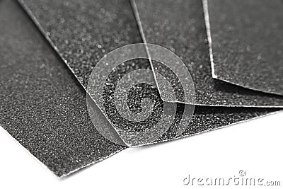 Black sandpaper sheets water proof on the white background. Stock Photo