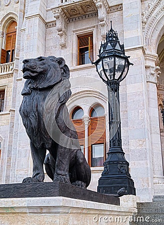 Black sculpture of lion and black lantern behind Editorial Stock Photo
