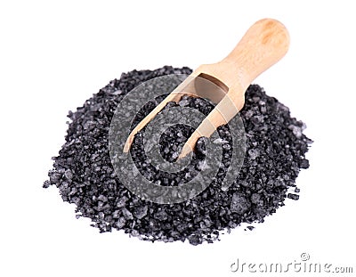 Black sea salt in a wooden spoon, isolated on white background. Volcanic salt in crystals. Stock Photo