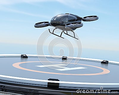 Black self-driving passenger drone takeoff from helipad Stock Photo
