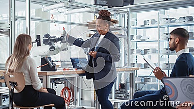 Black Senior Engineer Giving Computer Science Lecture to Diverse Multiethnic Group of Female and Stock Photo