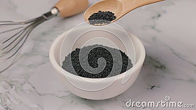 Black Sesame close up shot on Marble table Stock Photo