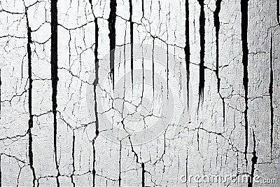 Black shabby cracks on the white concrete old wall. Grunge cracked surface texture with abstract traces of destruction Stock Photo