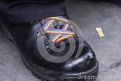 Black shoe with rainbow shoe laces Editorial Stock Photo