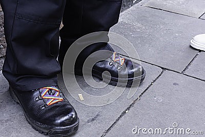 Black shoes with rainbow shoe laces Editorial Stock Photo