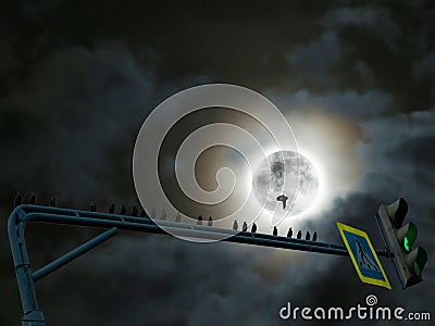 Black silhouettes of bird flock sitting on green street light on the background of dramatic Moon night Stock Photo