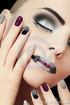 Black silver fashion glamorous manicure and makeup . Stock Photo