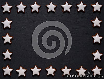 Black slate board with star-shaped cookie frame Stock Photo