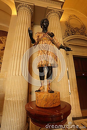 Black slave statue at Louvre museum in Paris Editorial Stock Photo