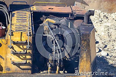 Black smoking exhaust pipe of old excavator Stock Photo