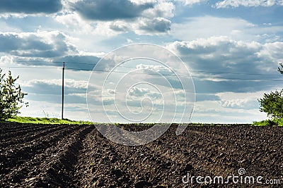 Black soil plowed field Stock Photo