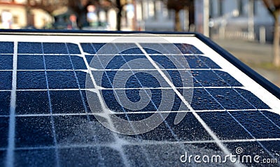 Black solar panel frozen by hoarfrost on the street. used to charge the device parking meter, information interactive screen, traf Stock Photo