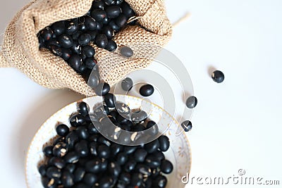 Black soya bean in burlap sack Stock Photo