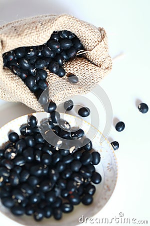 Black soya bean in burlap sack Stock Photo