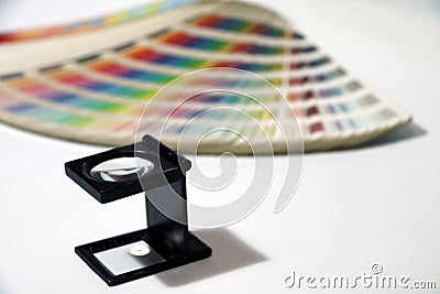 Black square Magnifying glass and Rainbow Sample Colors Palette Catalog. Stock Photo