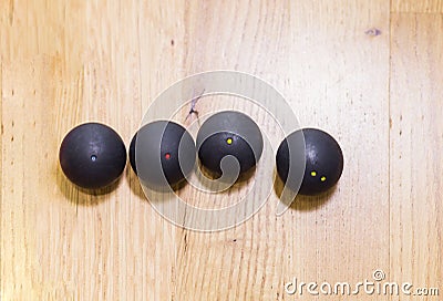 Black squash balls in squash court in tennis club Stock Photo