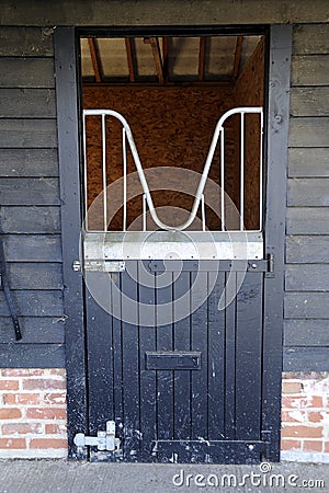 Black stable door, at equine barn. Stock Photo