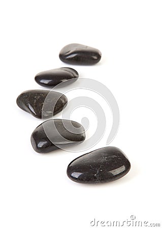 Black stepping stones in a row Stock Photo