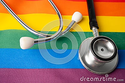 Black stethoscope on rainbow background, symbol of LGBT pride month celebrate annual in June, social, of gay, lesbian, bisexual, Stock Photo