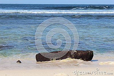 A black stone on the beach Stock Photo