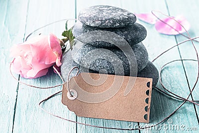 Black stones with roses and tag Stock Photo