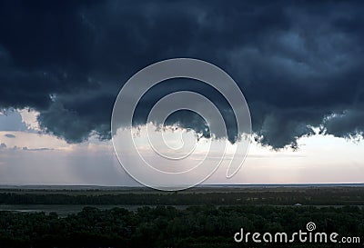 A black storm cloud above the city Stock Photo