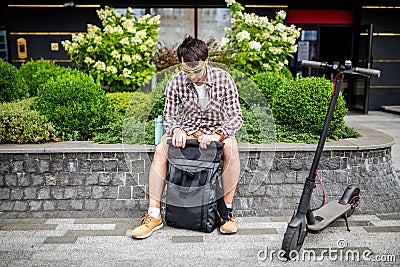 Black stylish retro vintage backpack. Bag with leather trim, roll-top clasp. Urban rucksack. Travel haversack. Drawstring knapsack Stock Photo