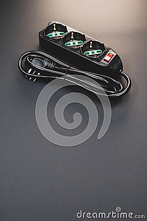 Black surge protector on a black background Stock Photo