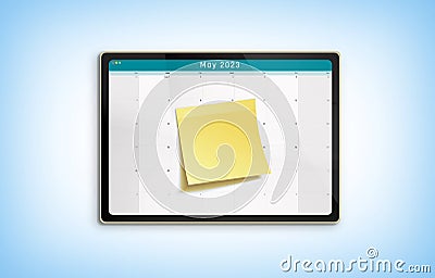 May 2023 Calendar on a Digital Tablet with Yellow Sticky Note Pad Stock Photo