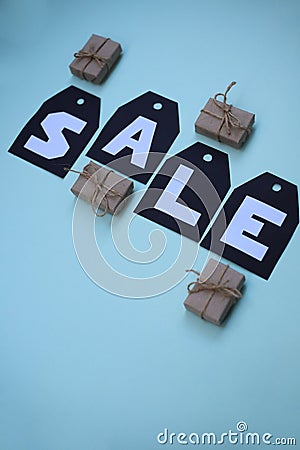 On black tags there is an inscription in white letters, the word is for sale Stock Photo