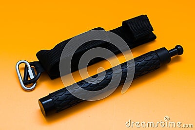 Black telescopic expandable baton / truncheon isolated Stock Photo