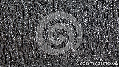 Black textured crinkled background. Black wrinkled fabric with lace inserts Stock Photo