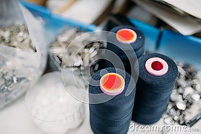 Black threads on spools closeup, sewing material Stock Photo