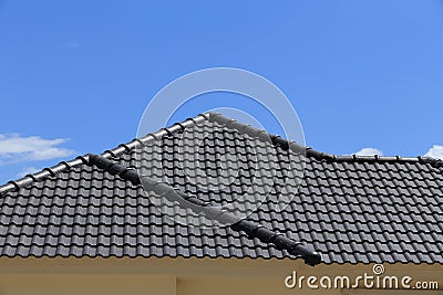 Black tiles roof on a new house Stock Photo